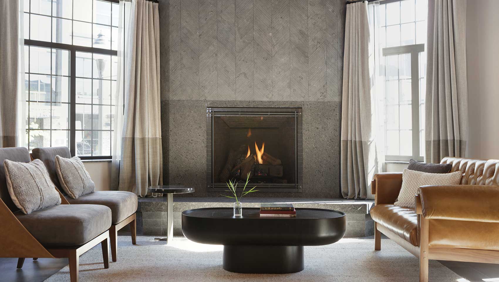 Lobby area with fireplace in the Kimpton Armory Hotel