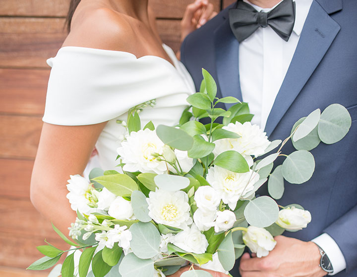 bride and groom with bouquet