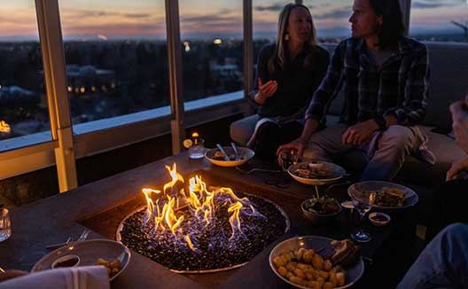 Group gathered around fire pit at Sky Shed